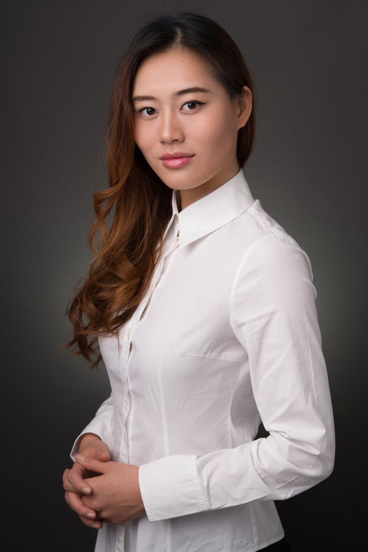 Corporate portrait of an asian woman in white shirt